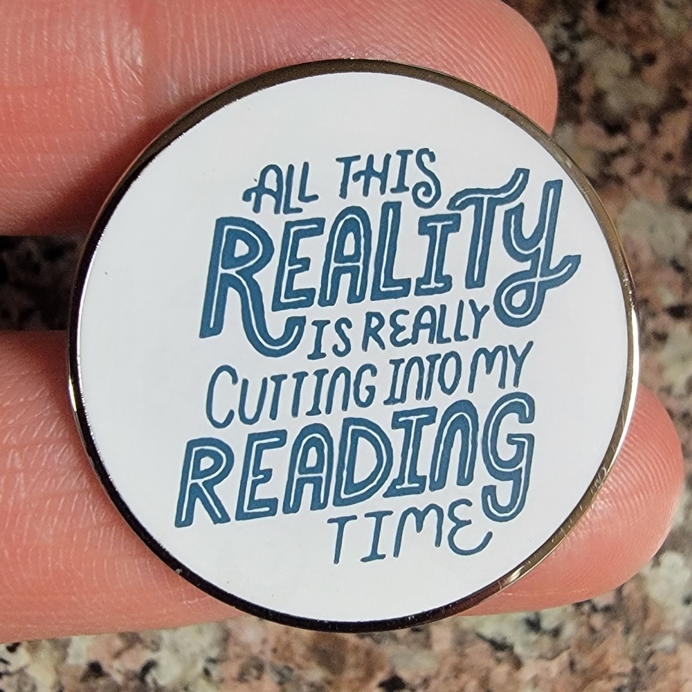 *Mix & Match 2 for $13* This Reality is Cutting my Reading Time Round Enamel Pin - Picture 1 of 3